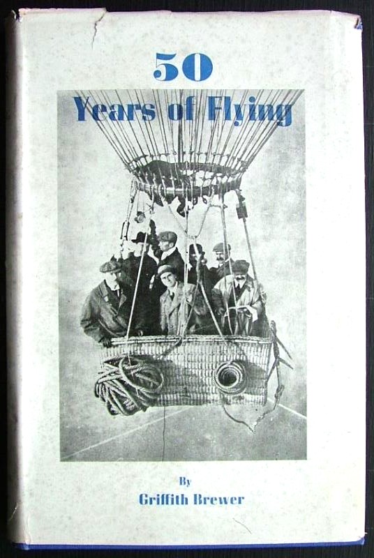 Image of the pictorial dust jacket showing seven men in hats and overcoats standing in a gas balloon basket in mid air.